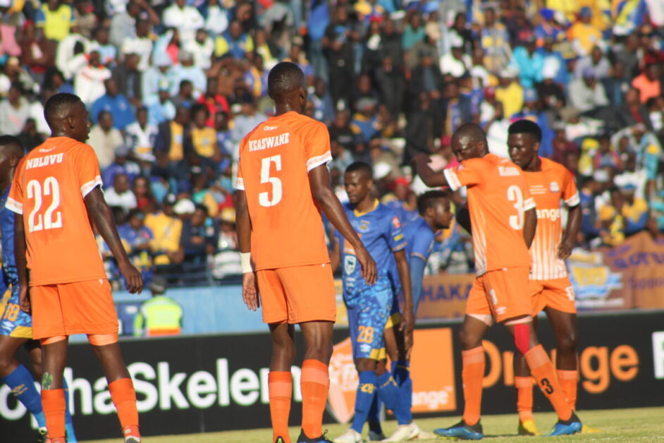 Botswana football, Orapa United and Township Rollers players in a field