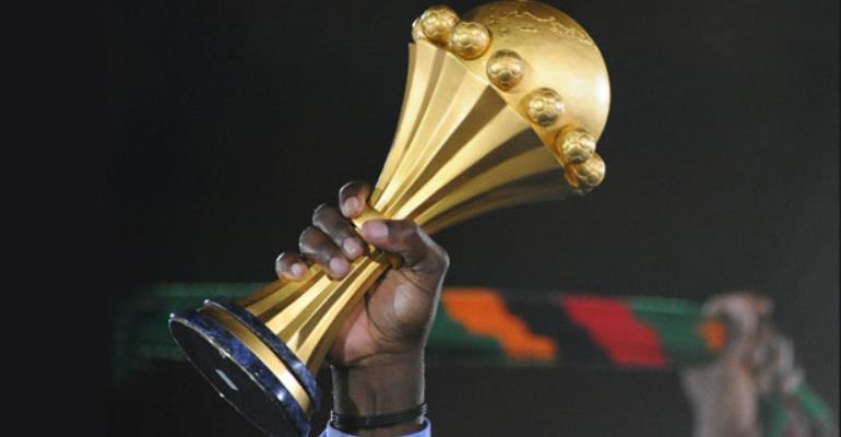 a hand holding an afcon title