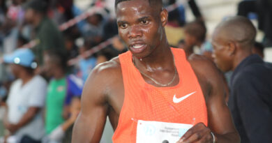 Botswana Athletics sensation Baboloki Thebe holding a water bottle after a race.